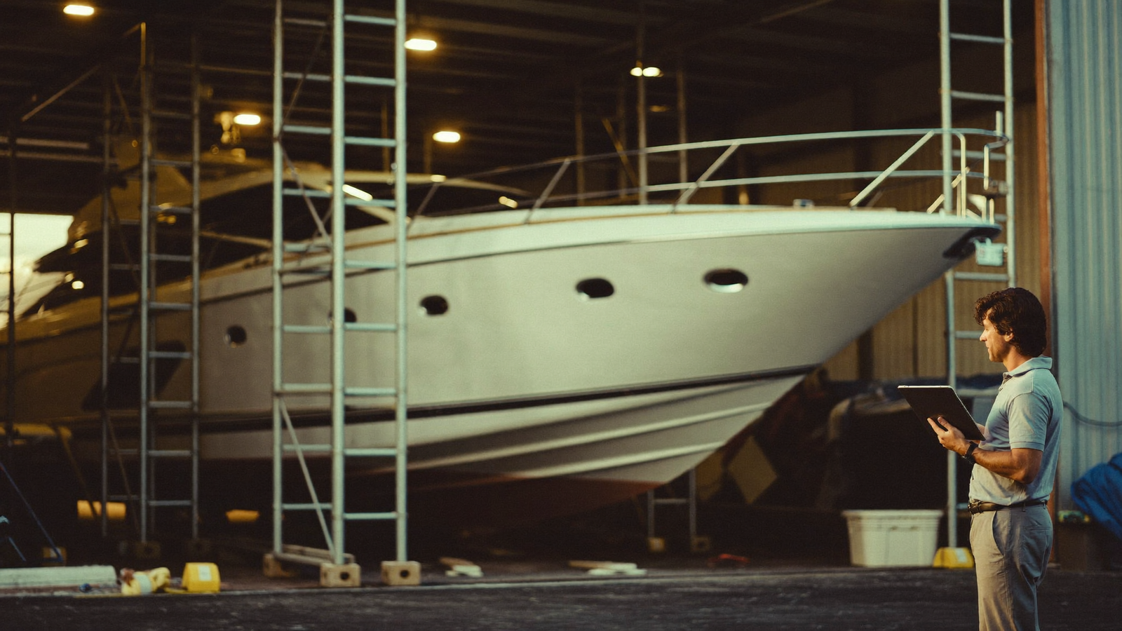 Superyacht in a covered refit shed