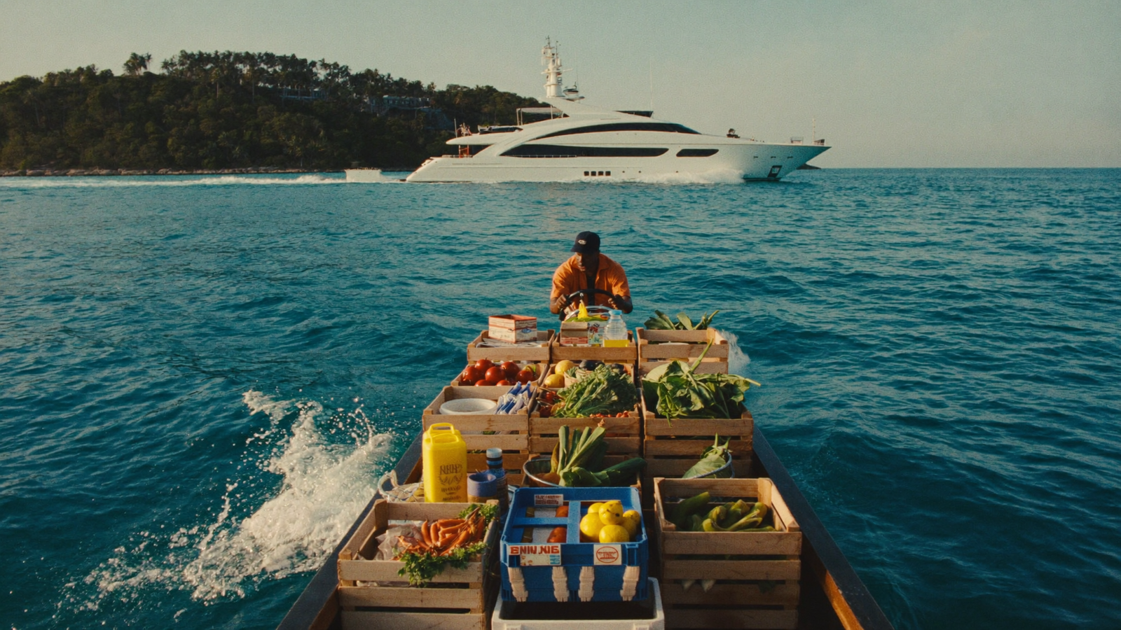 Tender loaded with provisions heading to an anchored yacht