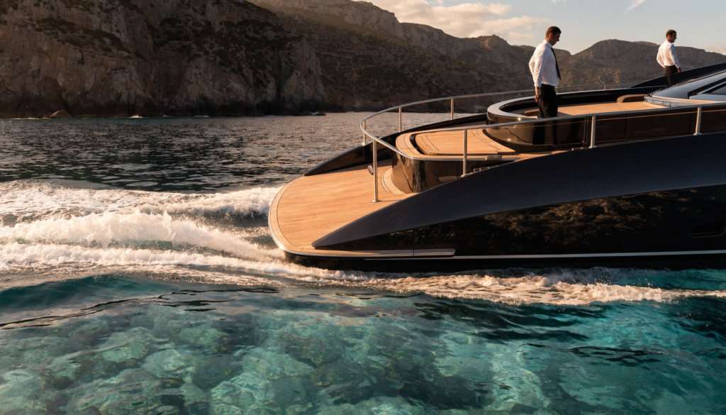 Superyacht cruising turquoise Mediterranean water at golden hour