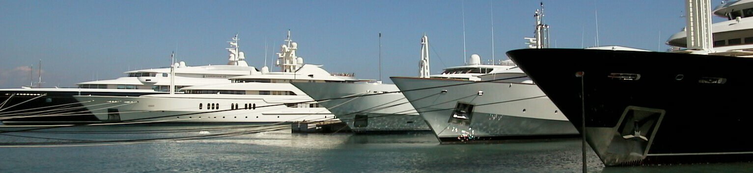 Superyacht bows lined up at the dock, a yacht managed by MTS Yachts in Fort Lauderdale